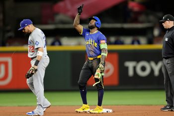 Sep 26, 2025; Seattle, Washington, USA; Seattle Mariners left fielder Randy Arozarena (56) points reaching second on a double against the Los Angeles Dodgers during the seventh inning at T-Mobile Park. Mandatory Credit: John Froschauer-Imagn Images