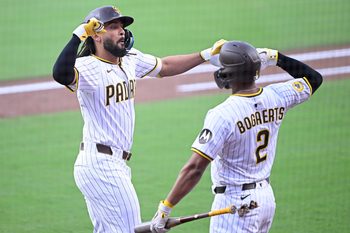 Sep 27, 2025; San Diego, California, USA; San Diego Padres right fielder Fernando Tatis Jr. (23) is congratulated by Luis Arraez (4) after hitting a solo home run during the first inning against the Arizona Diamondbacks at Petco Park. Mandatory Credit: Denis Poroy-Imagn Images