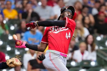 Sep 27, 2025; Milwaukee, Wisconsin, USA;  Cincinnati Reds shortstop Elly De La Cruz (44) loses his helmet while striking out during the ninth inning against the Milwaukee Brewers at American Family Field. Mandatory Credit: Jeff Hanisch-Imagn Images