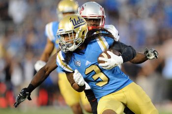 September 10, 2016; Pasadena, CA, USA;  UCLA Bruins defensive back Randall Goforth (3) carries the ball after intercepting a pass against the UNLV Rebels during the second half at Rose Bowl. Mandatory Credit: Gary A. Vasquez-Imagn Images