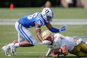 Sep 19, 2020; Durham, North Carolina, USA;  Duke Blue Devils linebacker Chris Rumph II (96) tackles Boston College Eagles quarterback Phil Jurkovec (5) at Wallace Wade Stadium. Mandatory Credit: Nell Redmond-Imagn Images