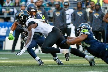 Oct 31, 2021; Seattle, Washington, USA; Jacksonville Jaguars wide receiver Laviska Shenault Jr. (10) runs for yards after the catch  as Seattle Seahawks middle linebacker Bobby Wagner (54) reaches for a tackle during the fourth quarter at Lumen Field. Mandatory Credit: Joe Nicholson-Imagn Images