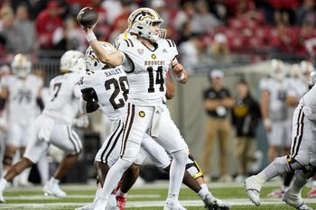 Sep 7, 2024; Columbus, Ohio, USA;  Western Michigan Broncos quarterback Broc Lowry (14) throws a pass against the Ohio State Buckeyes during the second half at Ohio Stadium.  Mandatory Credit: Adam Cairns-Imagn Images