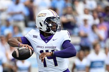 Sep 21, 2024; Chapel Hill, North Carolina, USA; James Madison Dukes quarterback Alonza Barnett III (14) looks to pass in the first quarter at Kenan Memorial Stadium. Mandatory Credit: Bob Donnan-Imagn Images