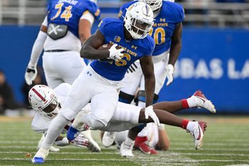 Nov 29, 2024; San Jose, California, USA; San Jose State Spartans running back Lamar Radcliffe (26) runs the ball against the Stanford Cardinal in the fourth quarter at CEFCU Stadium. Mandatory Credit: Eakin Howard-Imagn Images