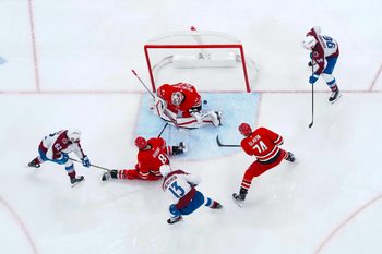 Dec 5, 2024; Raleigh, North Carolina, USA;  Colorado Avalanche right wing Valeri Nichushkin (13) scores a goal past Carolina Hurricanes goaltender Pyotr Kochetkov (52)  defenseman Brent Burns (8) and defenseman Jaccob Slavin (74) during the third period at Lenovo Center. Mandatory Credit: James Guillory-Imagn Images