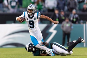 Dec 8, 2024; Philadelphia, Pennsylvania, USA;  Philadelphia Eagles linebacker Jalyx Hunt (58) tackles Carolina Panthers quarterback Bryce Young (9) during the fourth quarter at Lincoln Financial Field. Mandatory Credit: Bill Streicher-Imagn Images