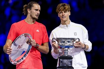 Jan 26, 2025; Melbourne, Victoria, Australia; Jannik Sinner of Italy and Alexander Zverev of Germany share a moment during the prize presentation of the men's single final at the 2025 Australian Open at Melbourne Park. Mandatory Credit: Mike Frey-Imagn Images