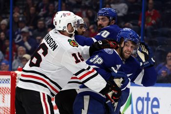 Jan 28, 2025; Tampa, Florida, USA; Chicago Blackhawks center Jason Dickinson (16) and Tampa Bay Lightning left wing Brandon Hagel (38) fight during the third period at Amalie Arena. Mandatory Credit: Kim Klement Neitzel-Imagn Images