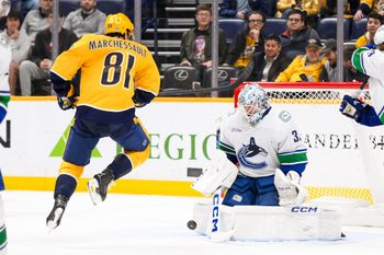 Jan 29, 2025; Nashville, Tennessee, USA;  Vancouver Canucks goaltender Thatcher Demko (35) blocks the shot of Nashville Predators center Jonathan Marchessault (81) during the third period at Bridgestone Arena. Mandatory Credit: Steve Roberts-Imagn Images