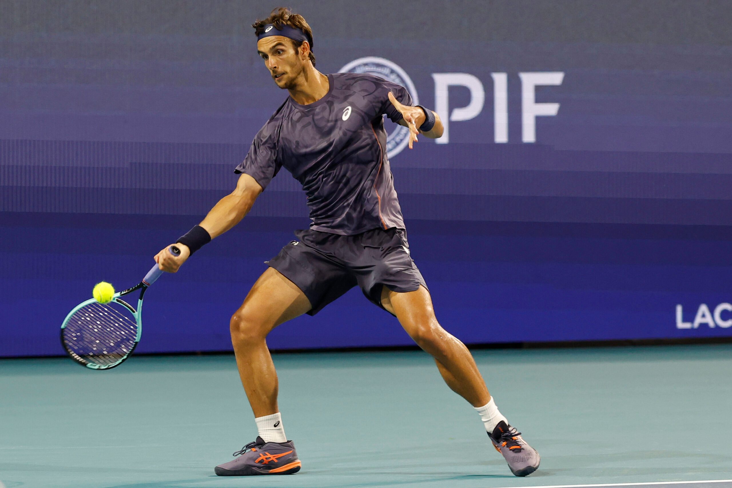 Mar 25, 2025; Miami, FL, USA; Lorenzo Musetti (ITA) hits a forehand against Novak Djokovic (SRB)(not pictured) on day eight of the Miami Open at Hard Rock Stadium. Mandatory Credit: Geoff Burke-Imagn Images