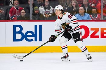 Apr 14, 2025; Montreal, Quebec, CAN; Chicago Blackhawks center Connor Bedard (98) plays the puck against the Montreal Canadiens in the first period at Bell Centre. Mandatory Credit: David Kirouac-Imagn Images