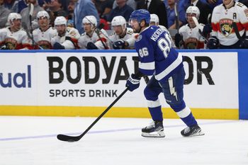 Apr 30, 2025; Tampa, Florida, USA; Tampa Bay Lightning right wing Nikita Kucherov (86) skates with the puck against the Florida Panthers during the second period of game five of the first round of the 2025 Stanley Cup Playoffs at Amalie Arena. Mandatory Credit: Kim Klement Neitzel-Imagn Images