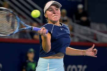 Jul 29, 2025; Montreal, QC, Canada; Sofia Kenin (USA) returns the ball against Victoria Mboko (CAN) in second round play at IGA Stadium. Mandatory Credit: Eric Bolte-Imagn Images