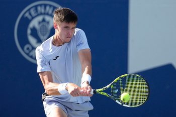 Aug 1, 2025; Toronto, ON, Canada; Fabian Marozsan (HUN) returns a ball to Flavio Cobolli (not pictured) during the third round at Sobeys Stadium. Mandatory Credit: John E. Sokolowski-Imagn Images