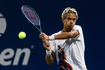 Aug 25, 2025; Flushing, NY, USA; Gabriel Diallo of Canada in action against Damir Dzumhur of Bosnia and Herzegovina in the first round of the men’s singles at the US Open at Billie Jean King National Tennis Centre. Mandatory Credit: Mike Frey-Imagn Images