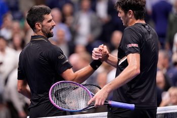 Sep 2, 2025; Flushing, NY, USA;  Novak Djokovic (SRB) (left) after defeating Taylor Fritz (USA) (right) on day ten of the 2025 U.S. Open tennis tournament at the USTA Billie Jean King National Tennis Center. Mandatory Credit: Robert Deutsch-Imagn Images