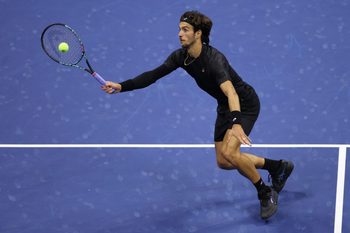 Sep 3, 2025; Flushing, NY, USA; Lorenzo Musetti (ITA) hits a shot against Jannik Sinner (ITA) (not pictured) on day eleven of the 2025 US Open tennis championships at USTA Billie Jean King National Tennis Center. Mandatory Credit: Mike Frey-Imagn Images