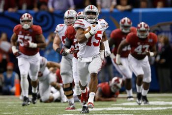 Ohio State Buckeyes running back Ezekiel Elliott (15) runs for an 85-yard touchdown in the fourth quarter of the Allstate Sugar Bowl college football playoff semifinal against the Alabama Crimson Tide at the Mercedes-Benz Superdome in New Orleans on Jan. 1, 2015. (Adam Cairns / The Columbus Dispatch)