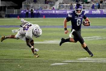 Sep 5, 2025; Evanston, Illinois, USA; Western Illinois Leathernecks defensive back Malini Ti'a (33) defends Northwestern Wildcats quarterback Preston Stone (8) during the second half at Northwestern Medicine Field at Martin Stadium. Mandatory Credit: David Banks-Imagn Images