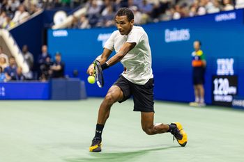 Sep 5, 2025; Flushing, NY, USA; Felix Auger-Aliassime of Canada in action against Jannik Sinner of Italy in the semifinal of the men’s singles at the US Open at Arthur Ashe Stadium in Billie Jean King National Tennis Center. Mandatory Credit: Mike Frey-Imagn Images