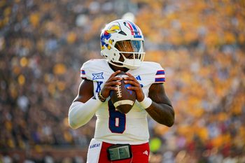Sep 6, 2025; Columbia, Missouri, USA; Kansas Jayhawks quarterback Jalon Daniels (6) warms up during the second half against the Missouri Tigers at Faurot Field at Memorial Stadium. Mandatory Credit: Jay Biggerstaff-Imagn Images