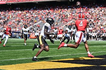 Sep 13, 2025; College Park, Maryland, USA;  Maryland Terrapins wide receiver Shaleak Knotts (4) catches a touchdown pass in the first half against the Towson Tigers at SECU Stadium. Mandatory Credit: Jamie Sabau-Imagn Images