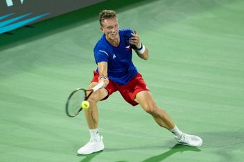 Sep 13, 2025; Delray Beach, FL, USA; Jiri Lehecka of Czechia returns a shot against Taylor Fritz of the United States in their Davis Cup match at Delray Beach Tennis Center. Mandatory Credit: Susan Mullane-Imagn Images