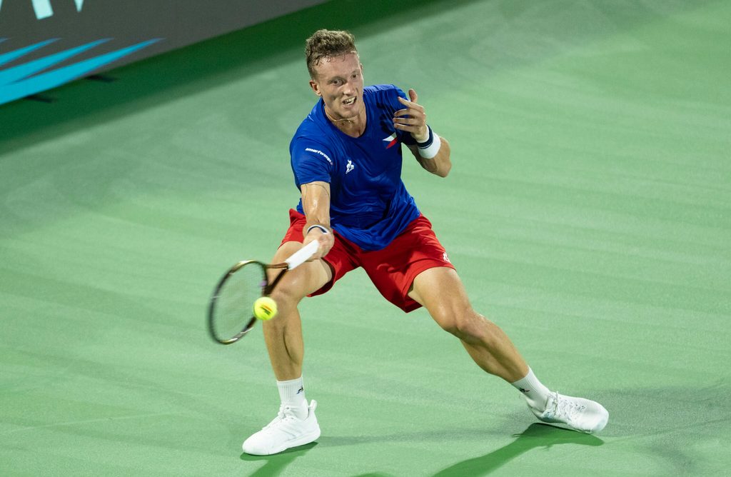 Sep 13, 2025; Delray Beach, FL, USA; Jiri Lehecka of Czechia returns a shot against Taylor Fritz of the United States in their Davis Cup match at Delray Beach Tennis Center. Mandatory Credit: Susan Mullane-Imagn Images