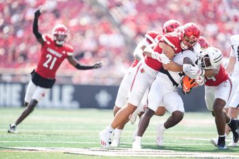Louisville Cardinals linebacker Kalib Perry stops Bowling Green Falcons running back Chris McMillian as the Cards (3-0) cruised past Bowling Green 40-17 in football Saturday, Sept. 20, 2025, in Louisville, Kentucky