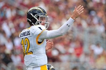 Sep 20, 2025; Tallahassee, Florida, USA; Kent State Golden Flashes quarterback Dru DeShields (12) directs players at the line during the first half against the Florida State Seminoles at Doak S. Campbell Stadium. Mandatory Credit: Melina Myers-Imagn Images