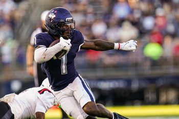 Sep 20, 2025; East Hartford, Connecticut, USA; Connecticut Huskies wide receiver Skyler Bell (1) runs the ball against et Ball State Cardinals in the second half at Pratt & Whitney Stadium at Rentschler Field. Mandatory Credit: David Butler II-Imagn Images
