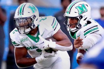 Marshall quarterback Carlos Del Rio-Wilson (7) hands the ball off to Marshall running back Michael Allen (2) during MTSU's Homecoming football game on Saturday, Sept. 20, 2025.