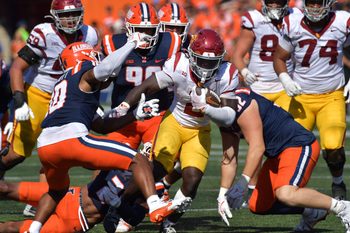 Sep 27, 2025; Champaign, Illinois, USA;  Southern California Trojans running back Waymond Jordan (2) runs through the Illinois Fighting Illini defensive line during the second half at Memorial Stadium. Mandatory Credit: Ron Johnson-Imagn Images