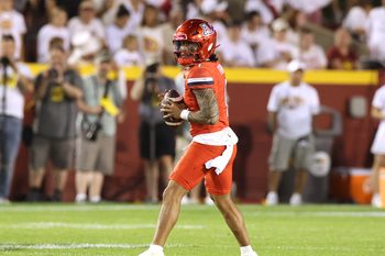 Sep 27, 2025; Ames, Iowa, USA; Arizona Wildcats quarterback Noah Fifita (1) looks to pass against the Iowa State Cyclones during the first half at Jack Trice Stadium. Mandatory Credit: Reese Strickland-Imagn Images