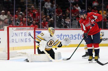 Oct 2, 2025; Washington, District of Columbia, USA; Washington Capitals left wing Alex Ovechkin (8) deflects the puck on Boston Bruins goaltender Joonas Korpisalo (70) in the first period at Capital One Arena. Mandatory Credit: Geoff Burke-Imagn Images