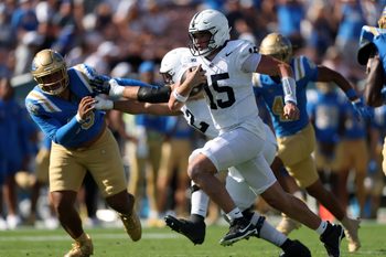 Oct 4, 2025; Pasadena, California, USA;  Penn State Nittany Lions quarterback Drew Allar (15) runs with the ball during the fourth quarter against the UCLA Bruins at Rose Bowl. Mandatory Credit: Kiyoshi Mio-Imagn Images