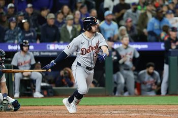 Oct 4, 2025; Seattle, Washington, USA; Detroit Tigers outfielder Kerry Carpenter (30) hits an RBI single in the eleventh inning against the Seattle Mariners during game one of the ALDS round for the 2025 MLB playoffs at T-Mobile Park. Mandatory Credit: Joe Nicholson-Imagn Images