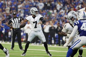 Oct 5, 2025; Indianapolis, Indiana, USA; Las Vegas Raiders quarterback Geno Smith (7) looks to pass the ball against the Indianapolis Colts during the second quarter at Lucas Oil Stadium. Mandatory Credit: Trevor Ruszkowski-Imagn Images