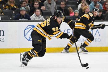 Sep 29, 2025; Boston, Massachusetts, USA;  Boston Bruins right wing David Pastrnak (88) passes the puck during the second period against the Philadelphia Flyers at TD Garden. Mandatory Credit: Eric Canha-Imagn Images