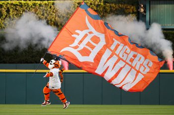 Oct 8, 2025; Detroit, Michigan, USA; PAWS the Detroit Tigers mascot celebrates the victory against the Seattle Mariners during game four of the ALDS round for the 2025 MLB playoffs at Comerica Park. Mandatory Credit: Rick Osentoski-Imagn Images