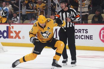 Oct 9, 2025; Pittsburgh, Pennsylvania, USA;  Pittsburgh Penguins center Evgeni Malkin (71) reacts after scoring a goal against the New York Islanders during the first period at PPG Paints Arena. Mandatory Credit: Charles LeClaire-Imagn Images