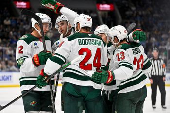 Oct 9, 2025; St. Louis, Missouri, USA; Minnesota Wild center Marco Rossi (23) is congratulated by teammates after scoring against the St. Louis Blues during the third period at Enterprise Center. Mandatory Credit: Jeff Curry-Imagn Images