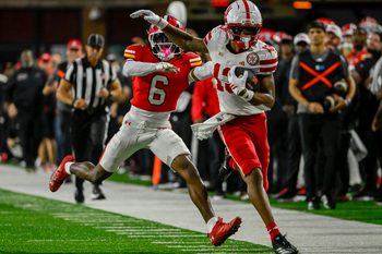 Oct 11, 2025; College Park, Maryland, USA;  Nebraska Cornhuskers wide receiver Nyziah Hunter (13) runs for a first down as Maryland Terrapins defensive back Dontay Joyner (6) defends during the second half at SECU Stadium. Mandatory Credit: Tommy Gilligan-Imagn Images