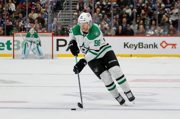 Oct 11, 2025; Denver, Colorado, USA; Dallas Stars right wing Mikko Rantanen (96) skates the puck up in a shootout against the Colorado Avalanche at Ball Arena. Mandatory Credit: Isaiah J. Downing-Imagn Images
