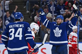 Oct 13, 2025; Toronto, Ontario, CAN; Toronto Maple Leafs right wing Calle Jarnkrok (19) celebrates a goal with center Auston Matthews (34) in the third period at Scotiabank Arena. Mandatory Credit: Gerry Angus-Imagn Images