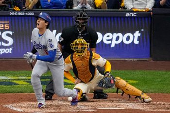 Oct 14, 2025; Milwaukee, Wisconsin, USA; Los Angeles Dodgers two-way player Shohei Ohtani (17) fouls a ball off his leg in the seventh inning during game two of the NLCS round for the 2025 MLB playoffs at American Family Field. Mandatory Credit: Michael McLoone-Imagn Images