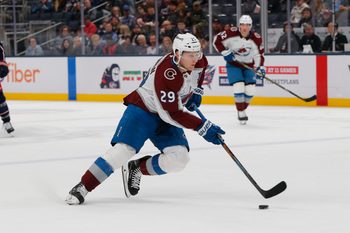 Oct 16, 2025; Columbus, Ohio, USA; Colorado Avalanche center Nathan MacKinnon (29) controls the puck against the Columbus Blue Jackets during the first period at Nationwide Arena. Mandatory Credit: Russell LaBounty-Imagn Images