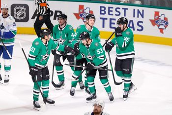 Oct 16, 2025; Dallas, Texas, USA; Dallas Stars center Wyatt Johnston (53) celebrates with teammates after scoring a goal against the Vancouver Canucks during the third period at American Airlines Center. Mandatory Credit: Chris Jones-Imagn Images