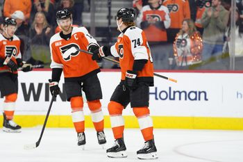 Oct 20, 2025; Philadelphia, Pennsylvania, USA; Philadelphia Flyers right wing Owen Tippett (74) reacts with center Sean Couturier (14) after scoring a goal against the Seattle Kraken in the first period at Xfinity Mobile Arena. Mandatory Credit: Kyle Ross-Imagn Images